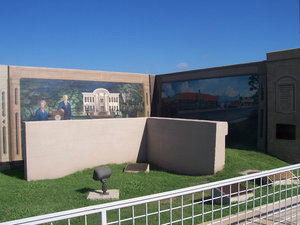 Governor And Mrs. Kirk Fordice And Jitney Jungle – A Preserved Section Of The Old Floodwall Is In The Foreground