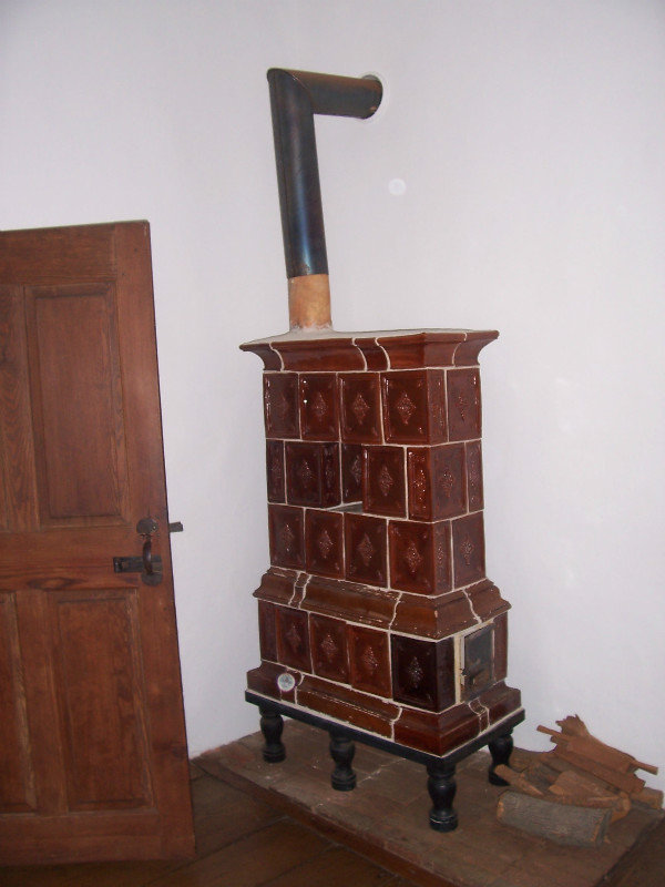 One Of The Two Tiled Heating Stoves