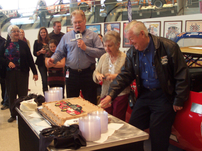Bobby Allison And His Wife Judy Cut The Birthday Cake – Luckily It Wasn’t A Cheese Cake!
