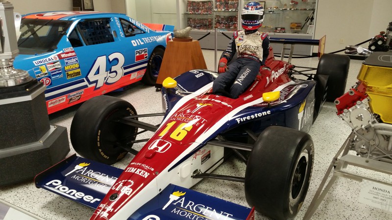 Dan Gurney Has Twelve Racing Classics From his Collection On Temporary Display In the Museum – Richard Petty’s 1992 NASCAR Entry (Background) And Danica Patrick’s 2005 “Rookie” Indy Car