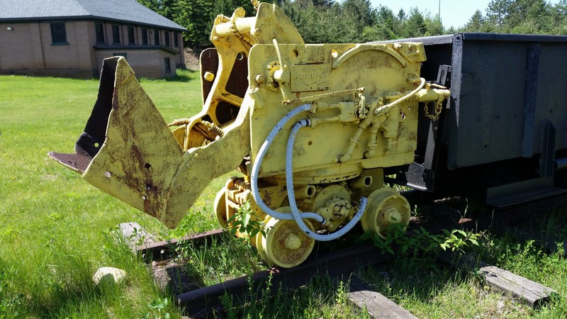 The Eimco 21 Overshot Shovel Loader Was Powered By Compressed Air And The Bucket Rotated In An Arc Over The Machine To Deposit The Rock In A Trailing Ore Car