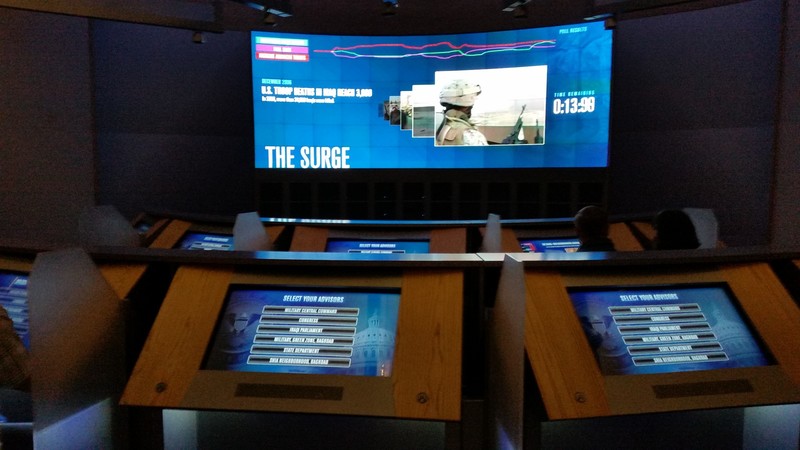 These Are The Consoles Visitors Use For The Decision-Making Exercise – Here The Topic, “The Surge;” The Task At Hand, “Select Your Advisors;” Time Remaining Before The Vote, 13:38
