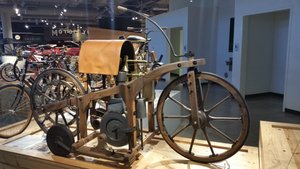 1885 Maybach Daimler Reitwagen REPLICA – Two German Engineers (Go Ahead, Guess Their Names) Constructed A Device To Mix Gasoline And Air, A Carburetor – “And The Beat Goes On …”
