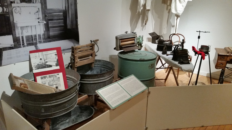 The Laundry Day Exhibit Not Only Displays The Artifacts But The Process Is Explained On The Placards At The Front Of The Exhibit – Note The Photograph Of The “Modern” Laundry Sink In The Background