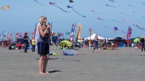 This Lady Was Asked to Hold onto the Kite by the Roaming Emcee – Eagerly Wanting to Do a Good Job
