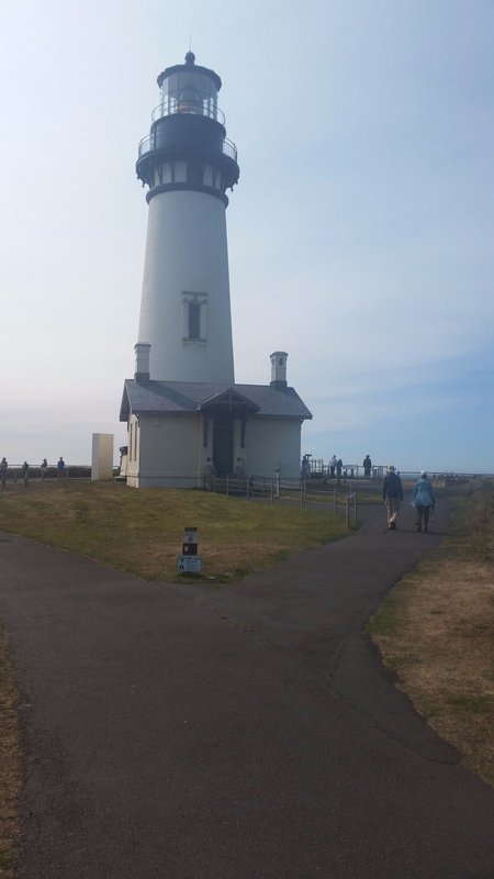 The Lighthouse Provokes a Forlorn Aura as It Sits, Almost Abandoned, Near the Rugged Coastline