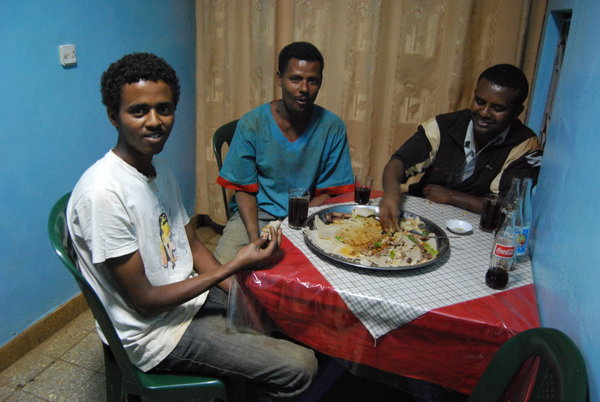 Archetypal Ethiopia bus crew complete with the usual local food; injera