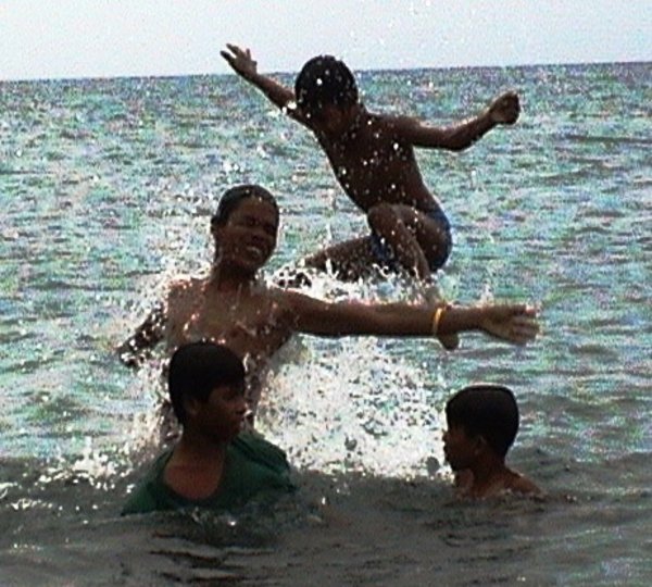 Local children playing with water