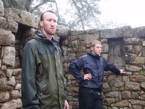 Chuck and Morgan are NOT happy about the rain on Day 4; taking a  break at the Sun Gate