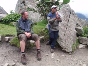 Chuck looks HUGE in this photo!  Peruvians are not really that tiny!  Victor is explaining how the Incas cut rocks without metal
