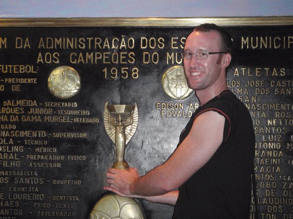 Posing with the World Cup at the soccer stadium