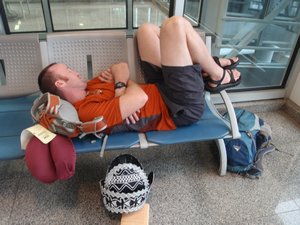 That doesnt look very comfortable!  Dozing at the airport before we fly from Rio to Sao Paolo