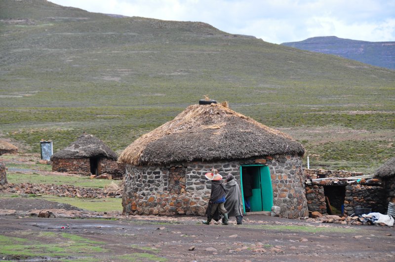 Typical hut and shepherds in traditional hats