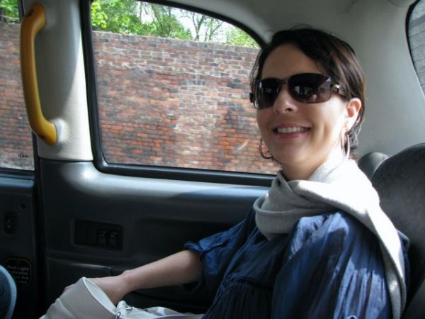 Vilma riding a black cab in Liverpool