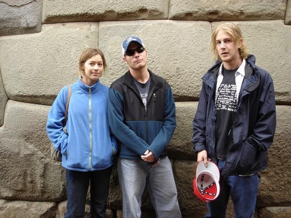 Chrissy, Tom and Jason in front of an Incan Wall