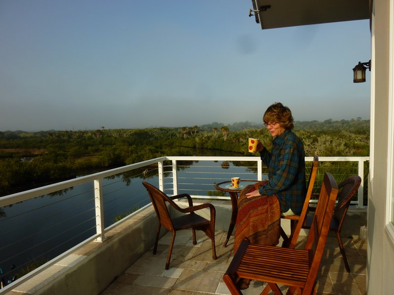 Deb on upper deck w/morning coffee