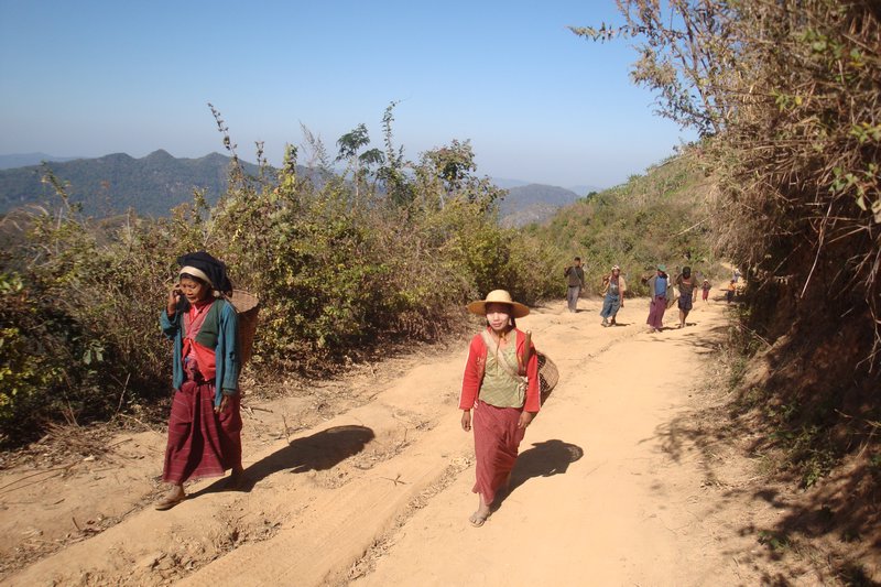 Villagers walking to town to sell their goods
