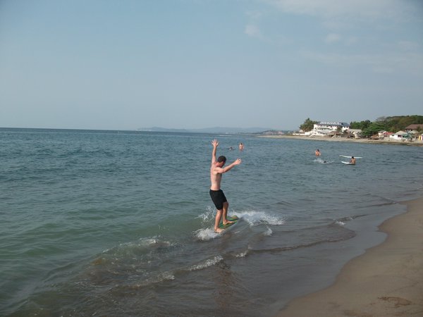 Trying out skimboarding