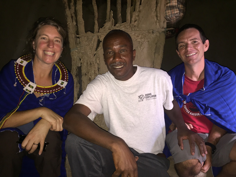 Hanging out in a Maasai house with our safari cook Julius, not a Maasai. 