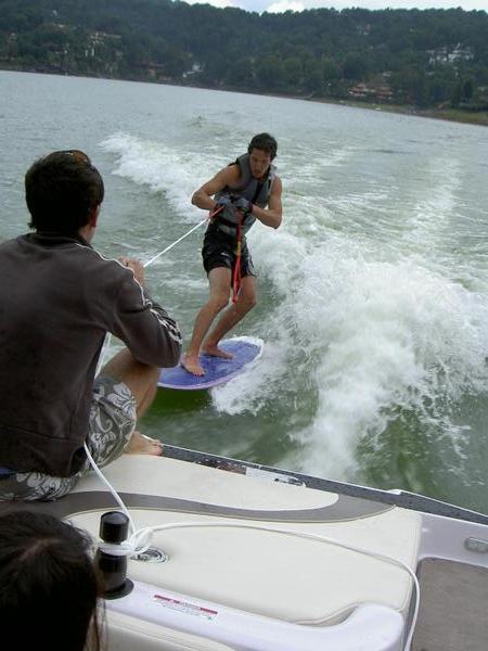 Learning to surf behind a brand new Ski Nautique boat