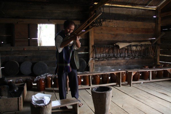 minority man playing traditional instrument