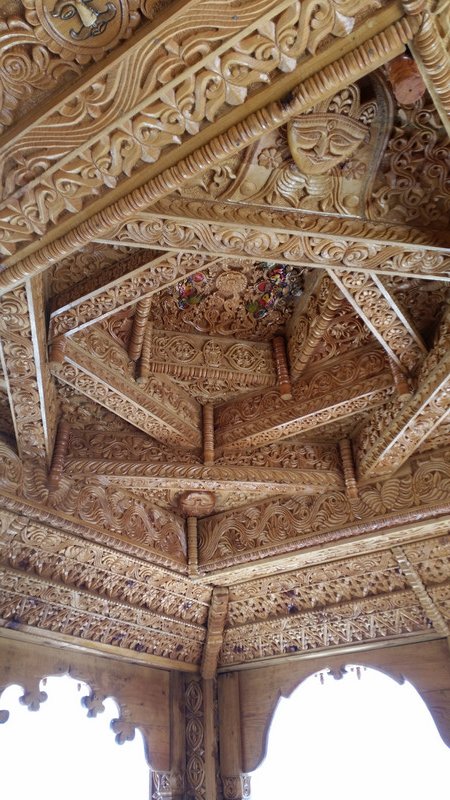 Ornate wood carved temple ceiling