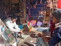 Shyam at the Barbar shop doubling as a kite shop for a week.... for 30 rps one can have a kite-string reel re-spun
