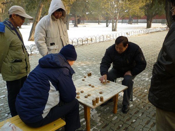 Locals playing chinese chess at the temple of heaven park