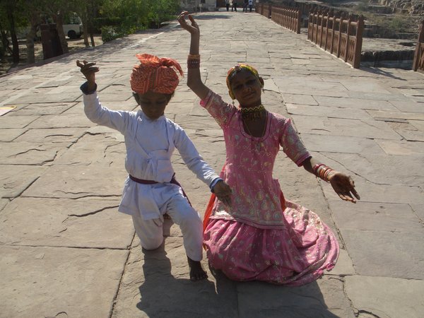 children dancing for money