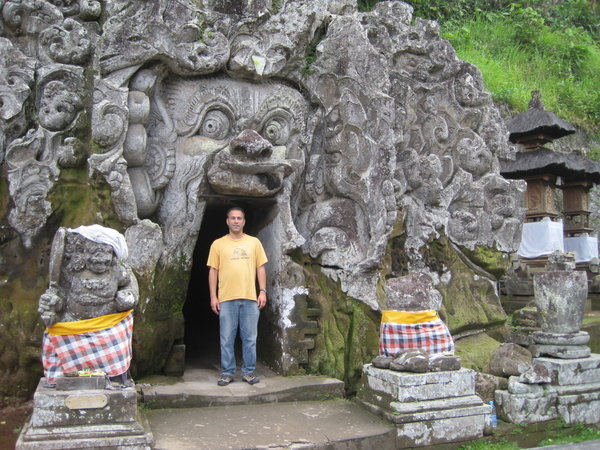 Handsome man at entrance to elephant caves near Ubud