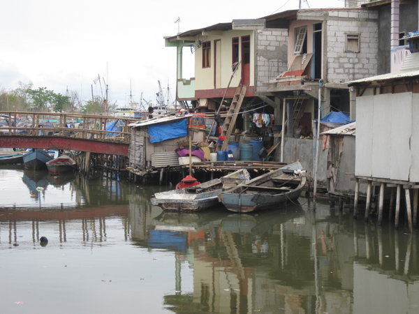 Houses and boats by the harbor, Jakarta