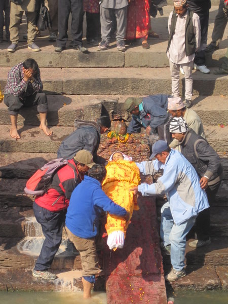 Preparing a body for cremation at Pashiputinath Temple, Kathmandu