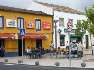 Typical small square with people sitting or standing around