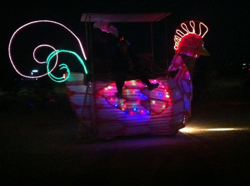 Chicken art car. I mean, you're in the middle of the desert and a neon chicken is driving by! LOL