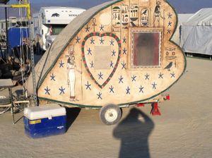 A heart shaped caravan at someone's camp
