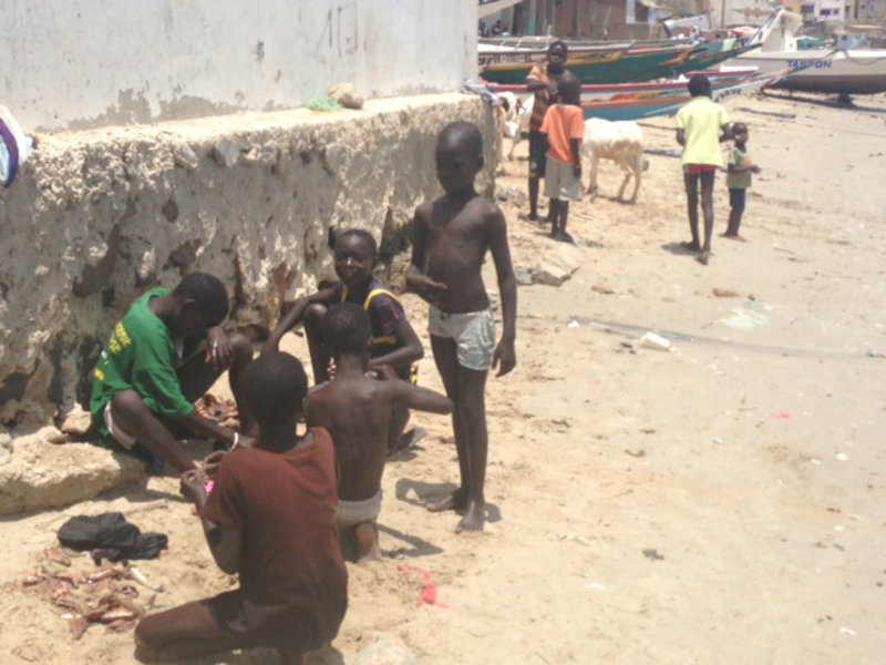 Kids playing at the "best beach" in Dakar. Too crowded and dirty to go swimming.