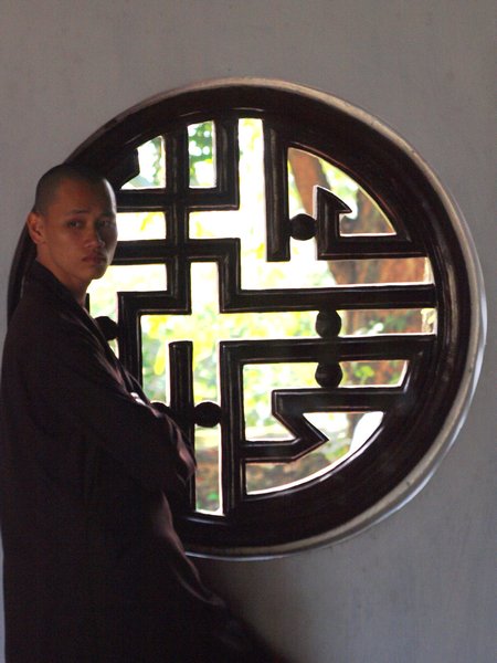Monk by Temple Window