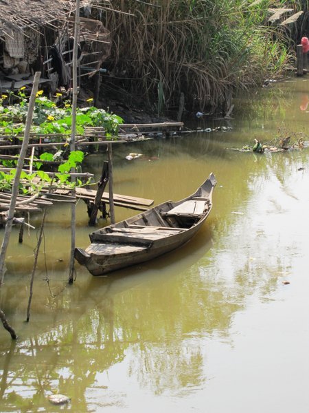a small family boat on the Siem Reap river