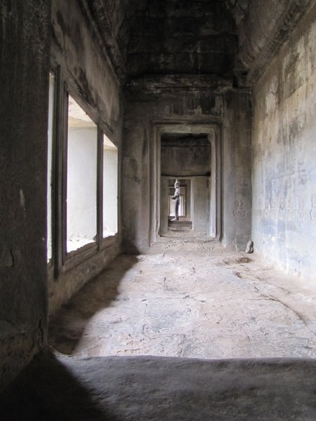 down a hallway in Angkor Wat