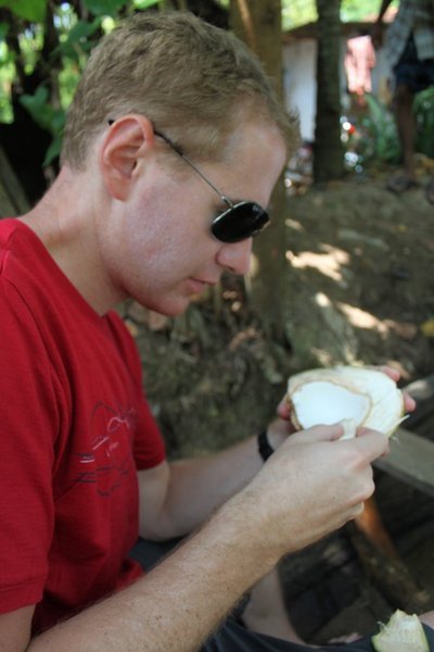 Digging in to fresh coconut