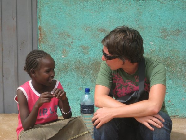 Having a chat while resting at the market in Dimeka