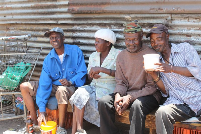 These friendly elders were sharing some umqombothi (home brew) 