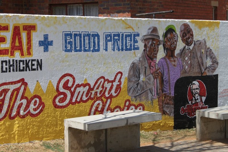 Colourful murals adorn the streets, this one a KFC rip-off
