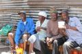 These friendly elders were sharing some umqombothi (home brew) 