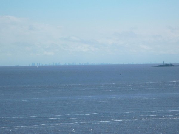 Buenos Aires towers on the horizon across the Rio Plata