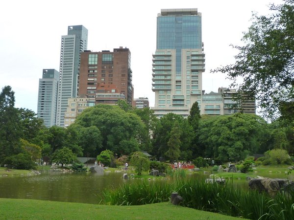 The Japanese garden in Palermo, city towers behind..