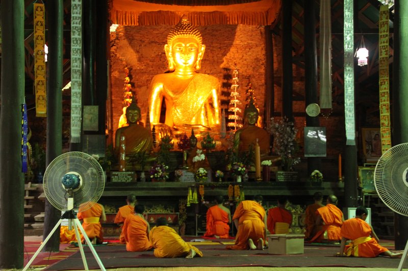Monks at prayer, Chiang Saen