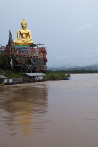 Golden Buddha on the banks of the Mekong at Sop Ruak 
