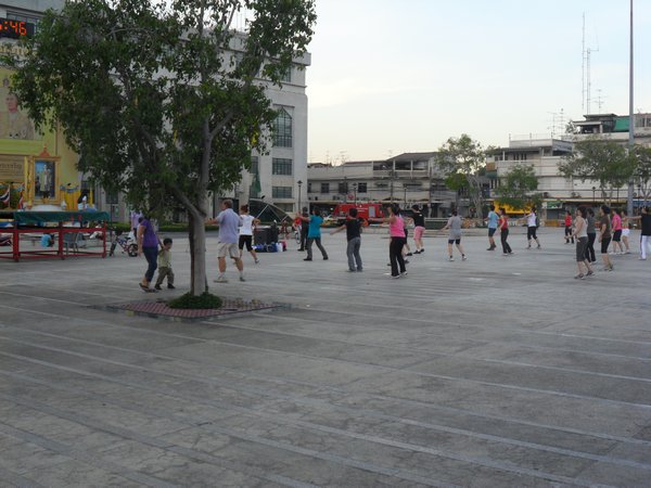 Outdoor aerobics to Lady Gaga in the square.