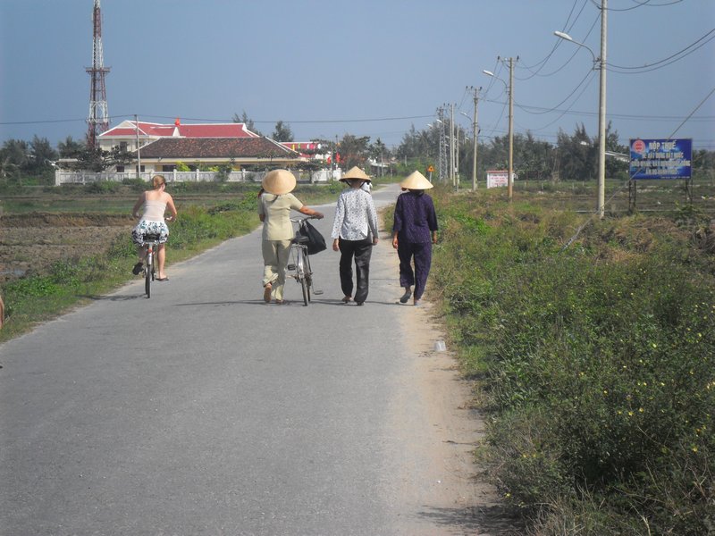 Lucy and some locals on the way to the beach in Hoi An